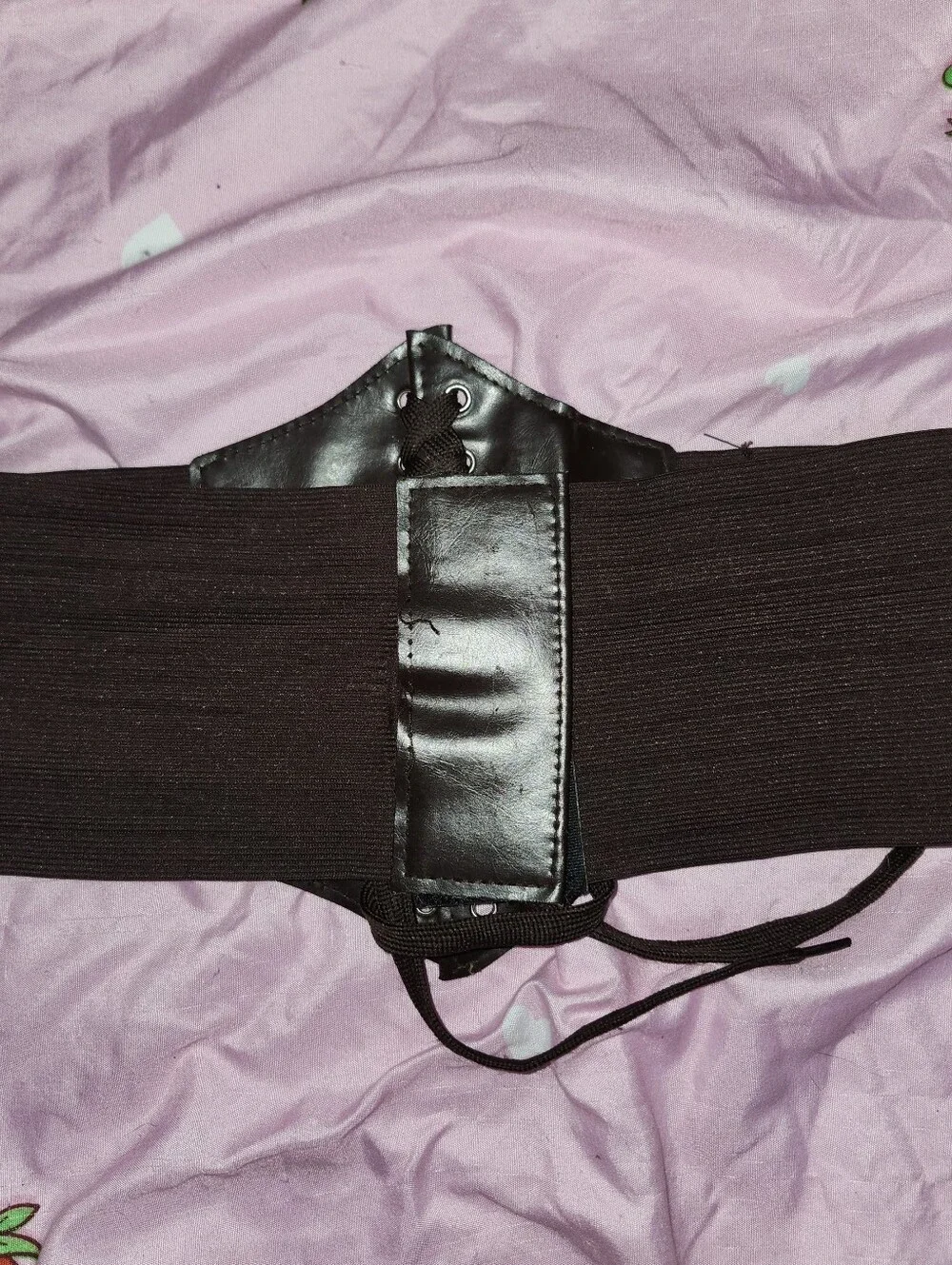 Brown faux leather corset belt with lace-up front and elastic